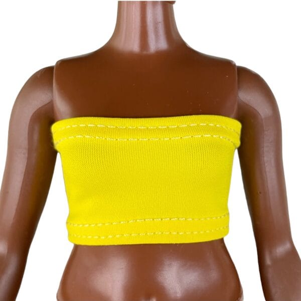 Doll Clothes Pack of 5 Tube tops for 11 inch Curvy size Barb Fashion Dolls 1:6 scale. 5 tube tops: electric pink, yellow, green, purple and blue colors. Fit Curvy size Barb dolls. CURVY SIZE DOLLS – 11 inch doll measurement: high 11 inch, Bust 5,25 inch, Waist 4,09 inch, Hips 6,02 inch. High-Quality Doll Clothes: Our set of 5 top doll clothes is perfect for high-resolution photography, creating doll stories, or making movies. They are designed not to leave any marks on the doll’s body and without any bulky fastenings. The unique design allows you to dress the doll from the head or bottom, ensuring the doll’s hairstyle remains perfect. Made of high-quality stretchy spandex, lycra, or jersey.